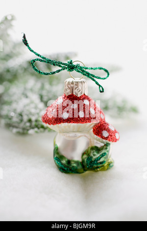 Christmas tree ornament (fly agaric) - Stock Photo