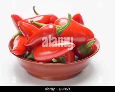 Red chillies in a red dish - Stock Photo