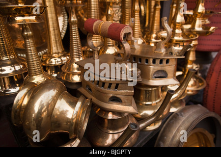 India, Kerala, Calicut, Kozhikode, Palayam Road, Copper Bazaar, old fashioned cast brass flat irons for sale Stock Photo