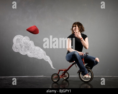 woman on a tricycle Stock Photo