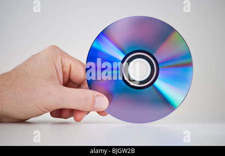 Hand holding compact disc Stock Photo