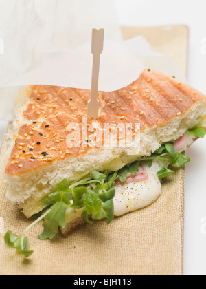 Flatbread filled with cheese, ham and rocket - Stock Photo