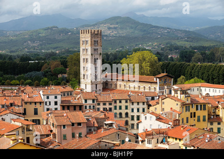 The tower of the Basilica di San Frediano rises above the mediaeval city of Lucca, Tuscany, Italy Stock Photo