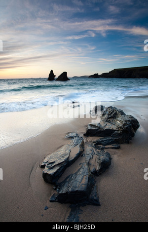 Rocks on the beach at Sunset, Porthcothan Bay Cornwall England Stock Photo