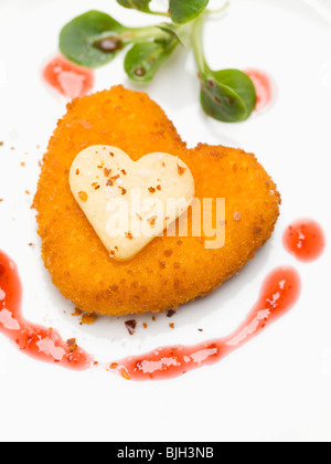 Deep-fried Camembert heart - Stock Photo