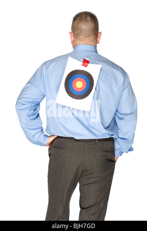 A businessman with a bulls eye that someone taped onto his shirt. Stock Photo