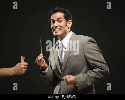 businessman drawing straws Stock Photo