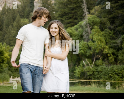 young couple by a pond Stock Photo