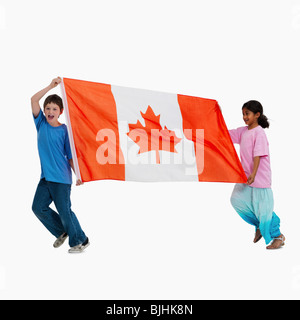 Children carrying Canadian flag Stock Photo