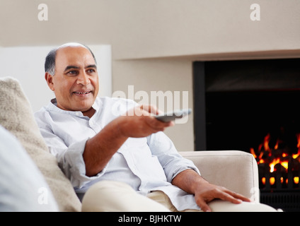 Man watching television Stock Photo