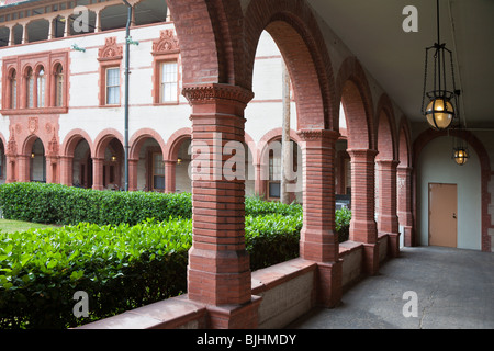 Portico around courtyard at Flagler College, an historic liberal arts school built by Henry Flagler in St. Augustine, Florida Stock Photo