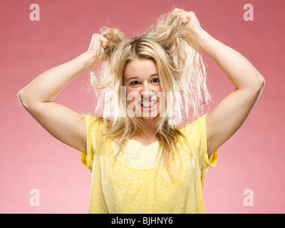 woman pulling out her hair Stock Photo