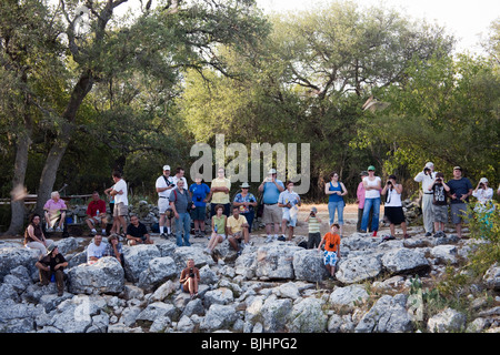 People gathered for bat flight at Bracken Cave, Texas, USA Stock Photo