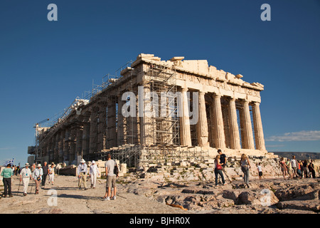 Tourists visit Parthenon on Acropolis in Greece. Stock Photo