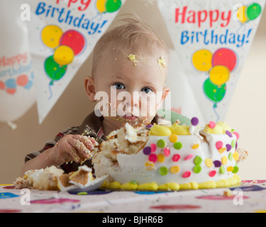 Baby eating birthday cake Stock Photo