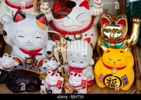 Maneki Neko literally 'Beckoning Cat'; is also known as Welcoming Cat, Lucky Cat, Money cat, or Fortune Cat Stock Photo