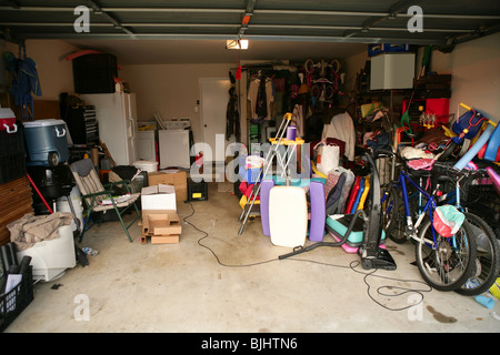 messy abandoned garage full of stuff, chaos at home Stock Photo