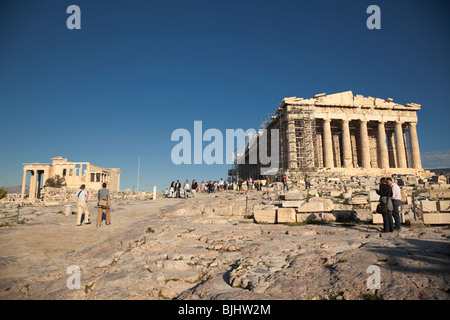 Tourists visit Parthenon on Acropolis in Athens. Stock Photo
