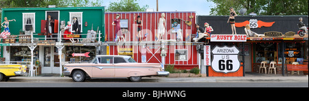 Two Ford Edsels in front of The Rusty Bolt souvenir shops and bikers bar in Seligman Arizona on Historic Route 66. Stock Photo