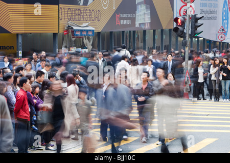 Crowds of people on the street in Hong Kong, China. Hong Kong is one of the most densely populated parts of the planet Stock Photo