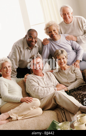 Couples in living room Stock Photo