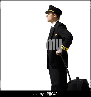 Profile of male pilot with luggage Stock Photo