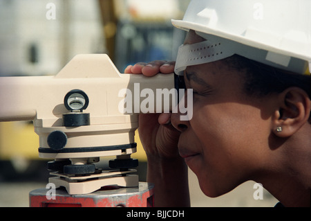 Surveyor using a theodolite Stock Photo