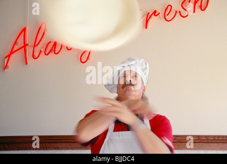 Cook tossing pizza dough, United States  1997 Stock Photo