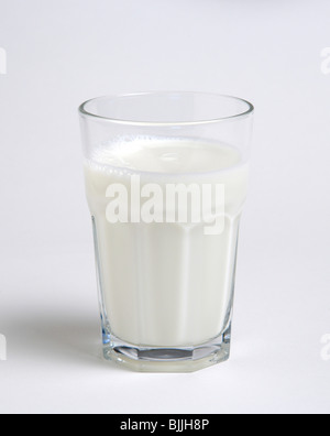 Drink, Milk, Tumbler glass of dairy milk against a white background. Stock Photo