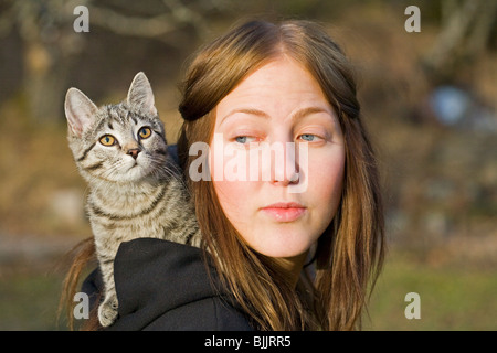 Girl cuddleing a Cat Stock Photo