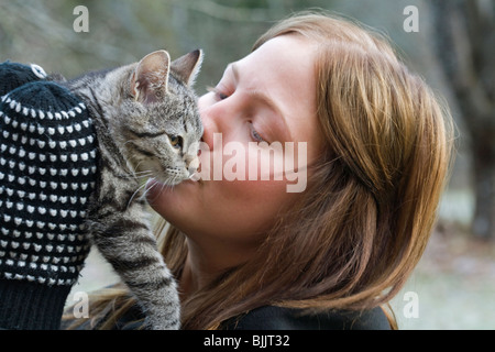 Girl cuddleing a Cat Stock Photo