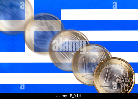 Greek national flag and falling euro coin, symbolic for the Greek national deficit and the falling euro course Stock Photo