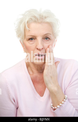 Woman holding her hand in horror on her cheek Stock Photo