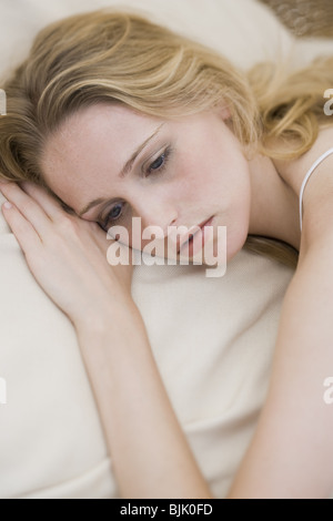 Stock image of young woman sleeping on white bed Stock Photo - Alamy
