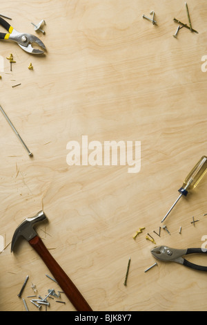 Tools and fasteners on hardwood floor Stock Photo