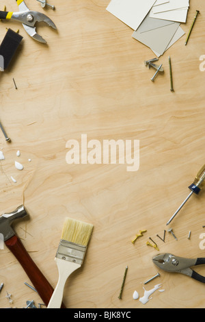 Tools and fasteners on hardwood floor Stock Photo