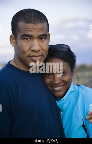 Man and woman hugging outdoors Stock Photo