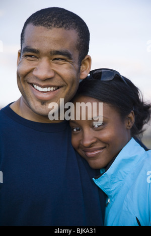 Man and woman hugging outdoors Stock Photo