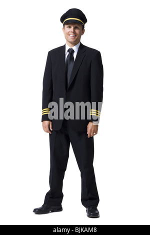 Pilot standing with arms crossed smiling Stock Photo