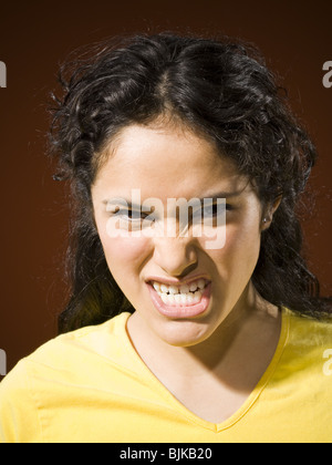 Portrait of a woman snarling Stock Photo