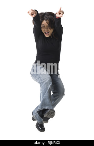 Casually dressed woman leaping Stock Photo