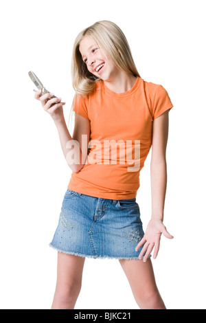 Girl holding cell phone smiling Stock Photo