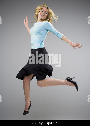 Woman in black dancing Stock Photo