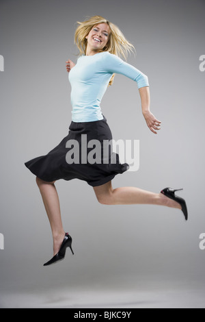 Woman in a black dress dancing at a silent disco, SWN festival, Cardiff ...