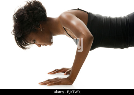 Woman doing pushups Stock Photo