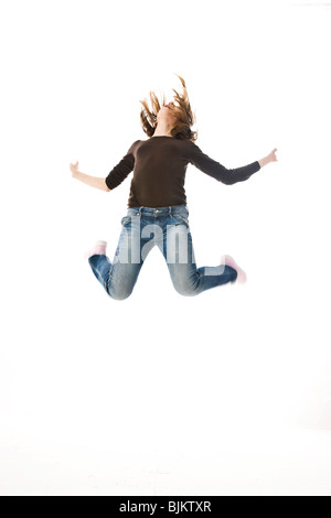 A girl leaping into the air Stock Photo