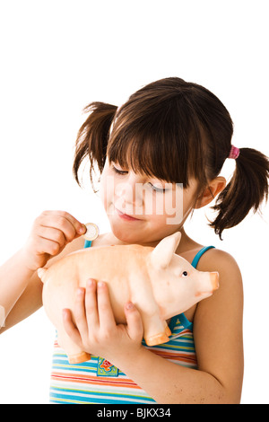 Little Girl with piggy bank Stock Photo