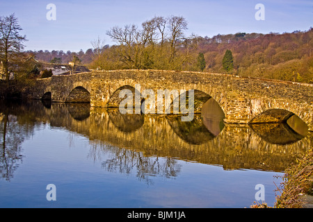 Newby Bridge reflecting in the early morning sun on Lake Windermere. Stock Photo