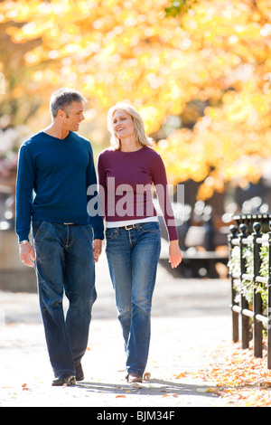 Couple walking outdoors Stock Photo