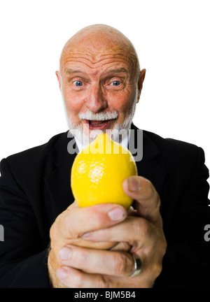 Mature businessman with lemon Stock Photo